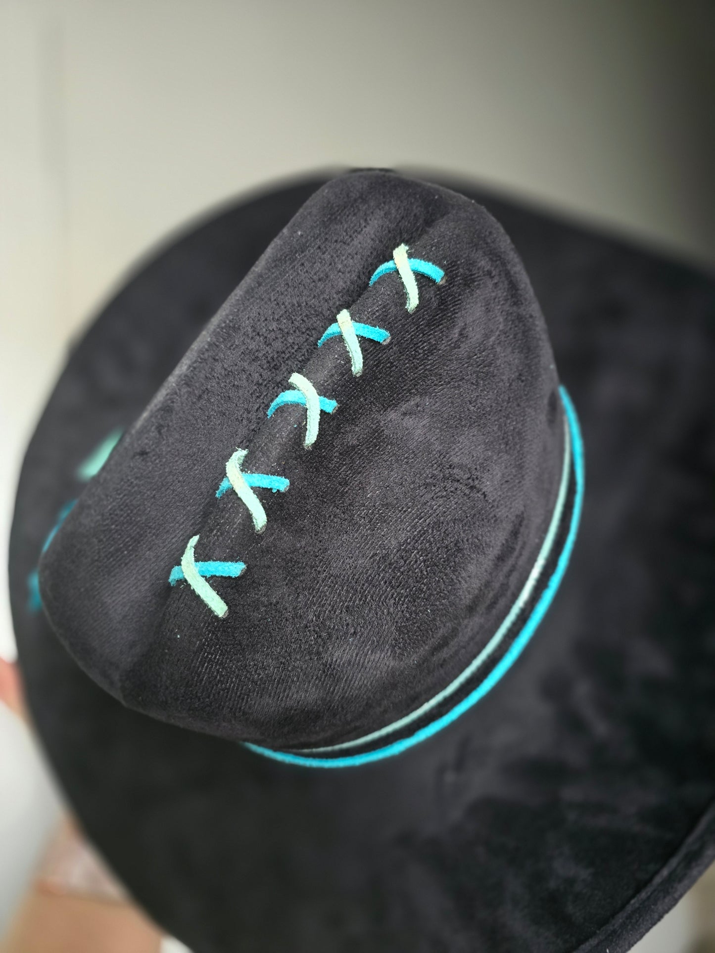 Black and turquoise tooled cowboy